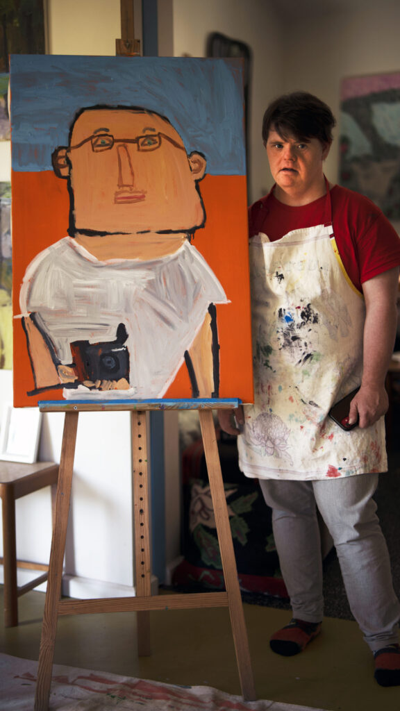 Digby with portrait of Trevor Grahama and cam